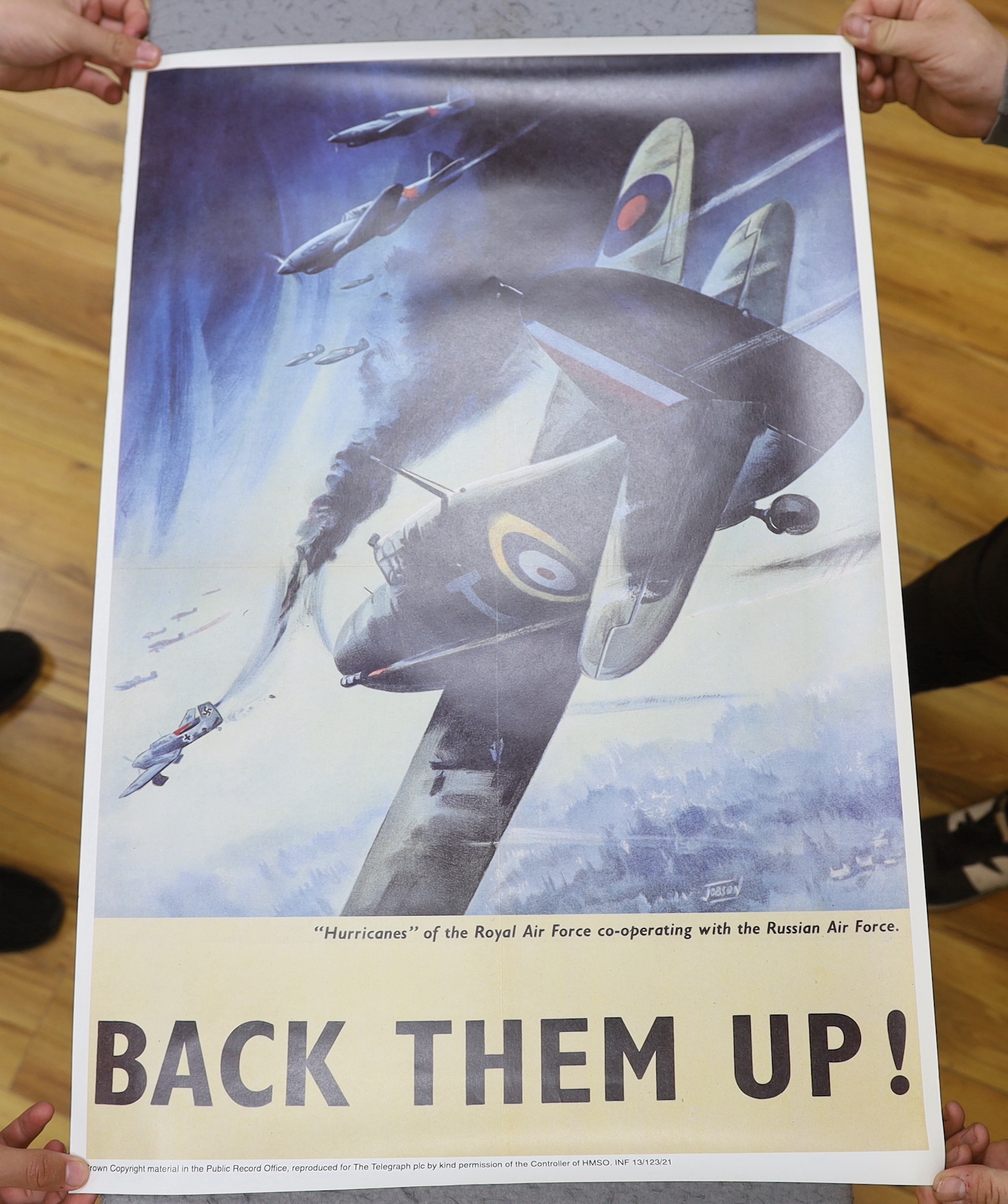 Seven facsimile re-print WWII propaganda posters and a poster of a spitfire